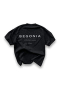 Black oversized tee, back, with BEGONIA print
